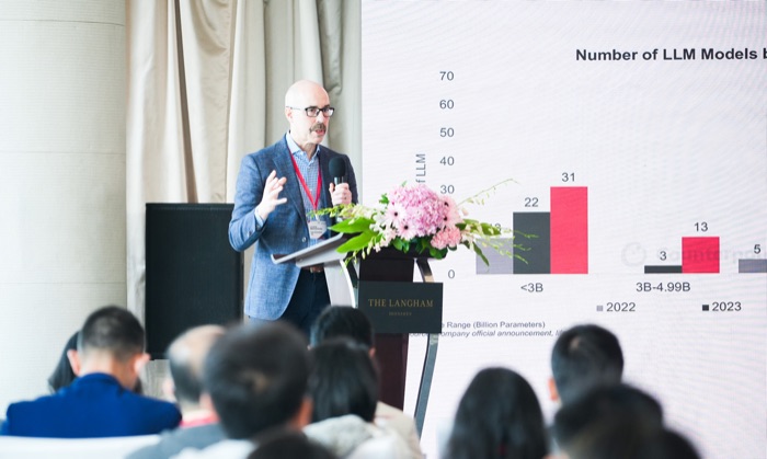 A Counterpoint analyst presenting research at a global industry event